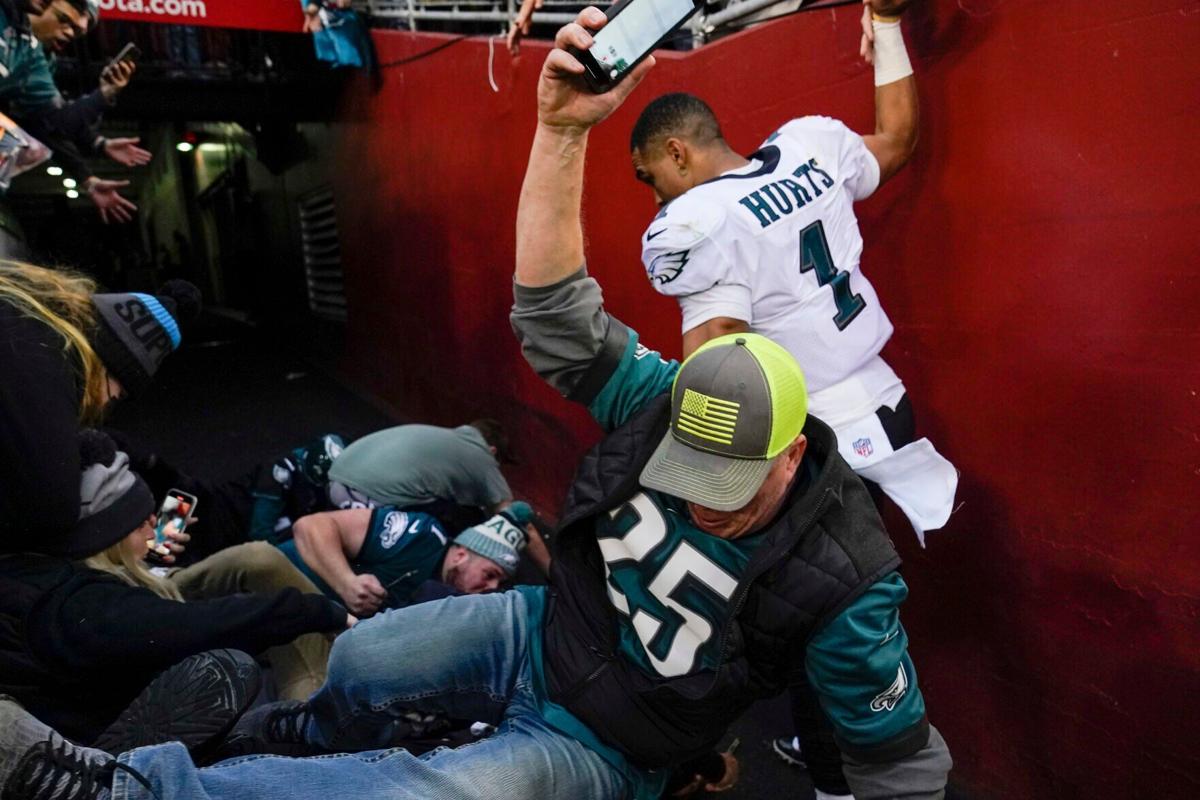 Philadelphia Eagles QB Jalen Hurts helps fans when railing collapses after  win over Washington Football Team, National Sports