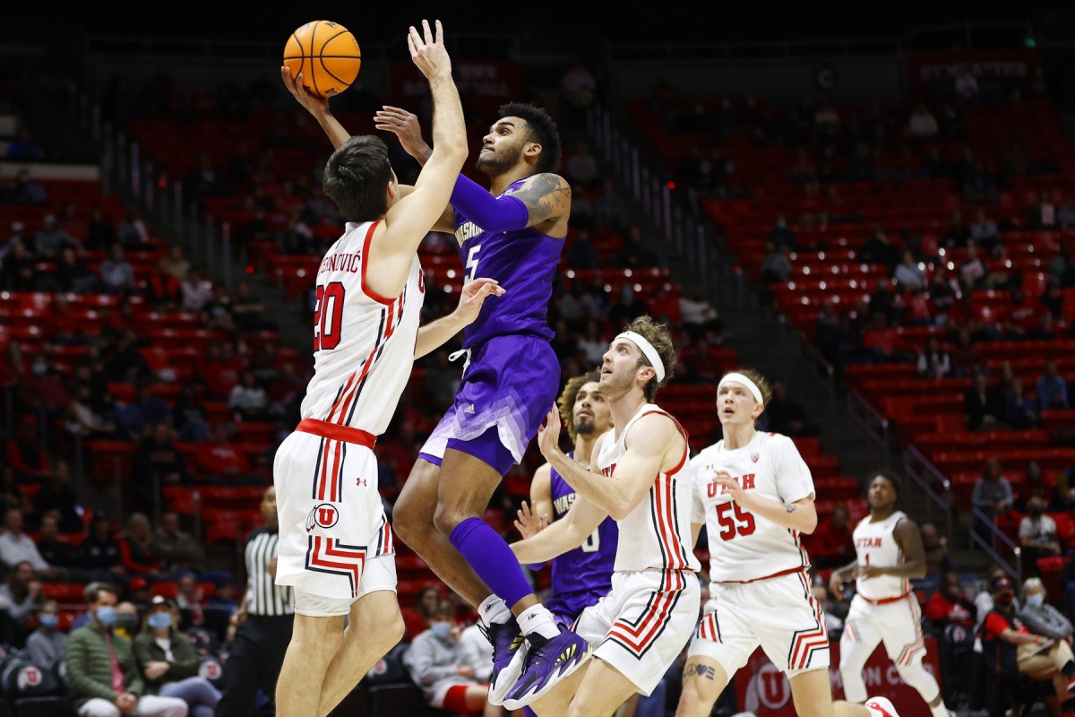 Jamal Bey drives for a bucket at Utah.