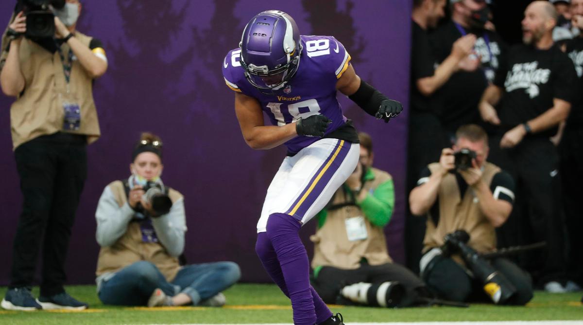 Minnesota Vikings wide receiver Justin Jefferson (18) celebrates in the end zone after catching a 45-yard touchdown pass during the second half of an NFL football game against the Chicago Bears, Sunday, Jan. 9, 2022, in Minneapolis.