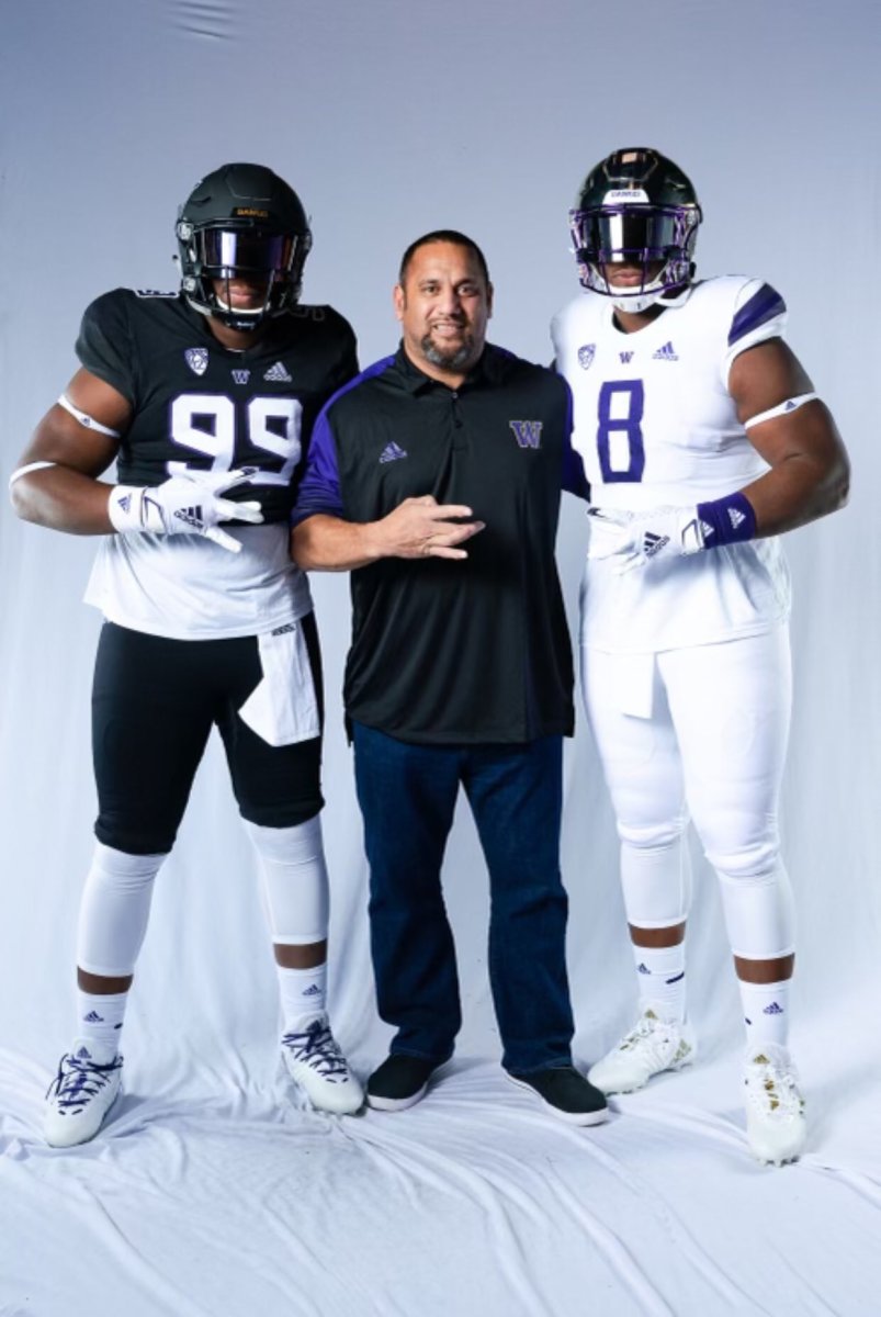 Armon and Jayvon Parker pose with UW defensive-line coach Inoke Breckterfield.