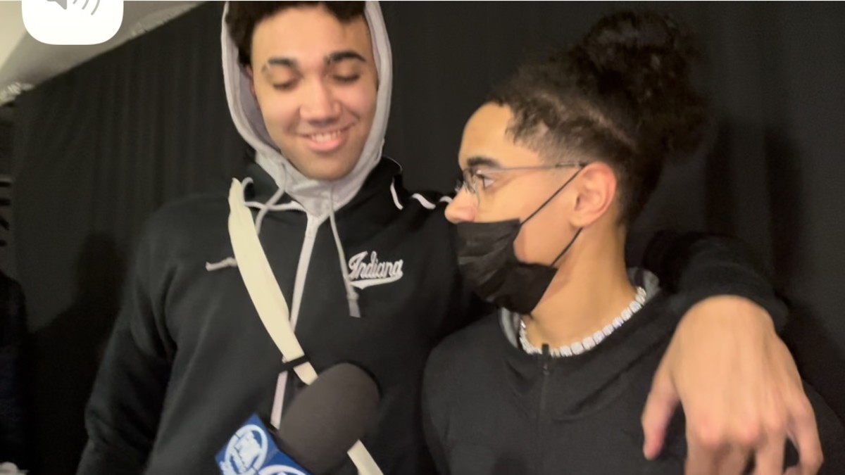 Indiana's Trayce Jackson-Davis puts his arm around Khristian Lander while the sophomore point guard answers questions from the media for the first time in a month.