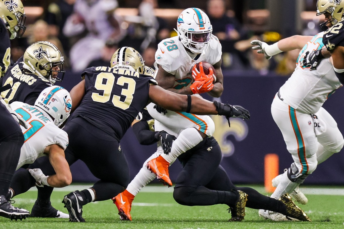 Miami Dolphins running back Duke Johnson (28) is tackled by New Orleans Saints defensive tackle David Onyemata (93). Mandatory Credit: Stephen Lew-USA TODAY 