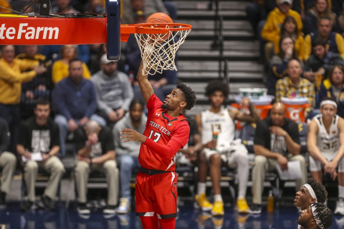 Feb 5, 2022; Morgantown, West Virginia, USA; Texas Tech Red Raiders guard Mylik Wilson (13) shoots a layup during the first half against the West Virginia Mountaineers at WVU Coliseum.