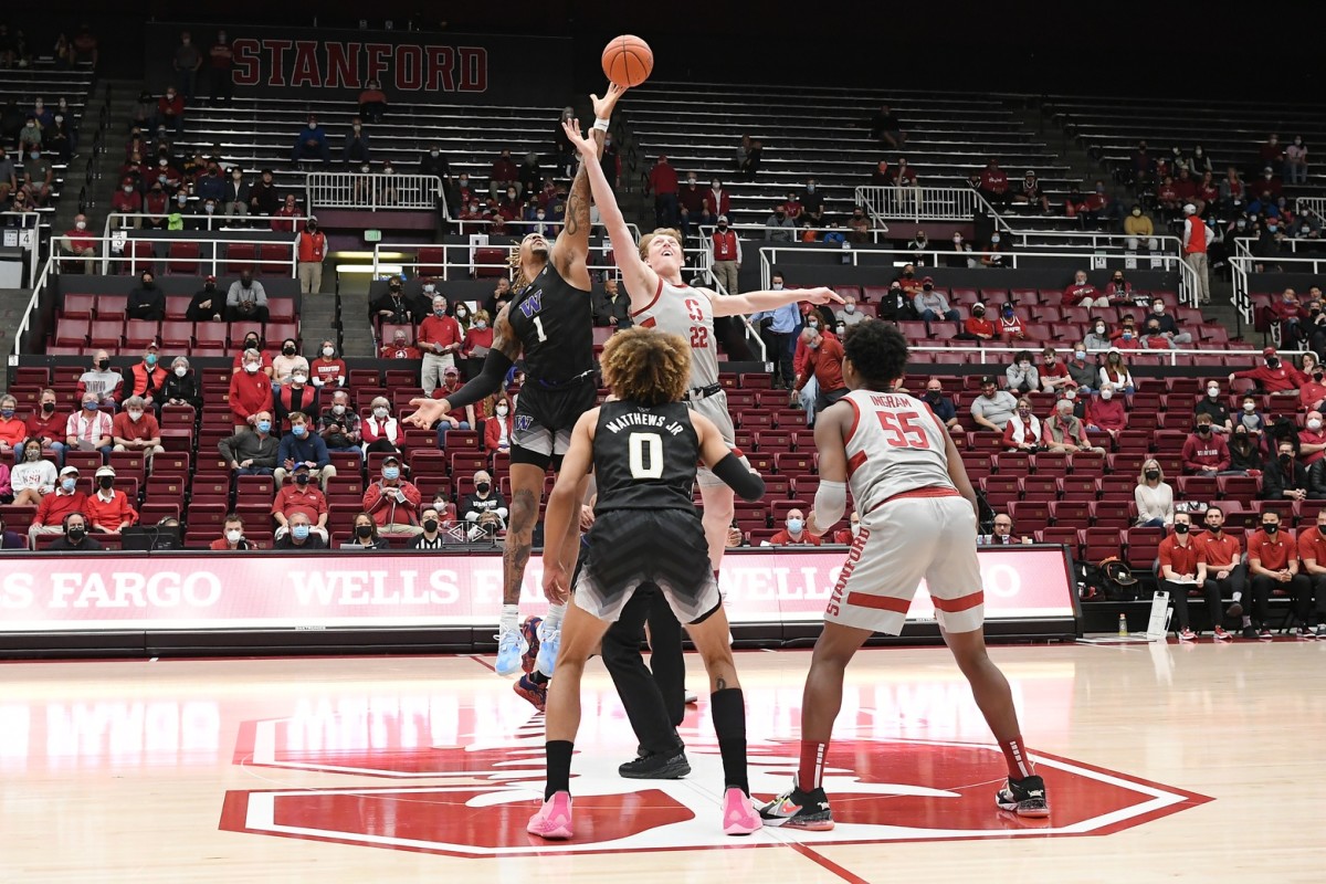 Nate Roberts and Stanford's James Keefe tip off the game.