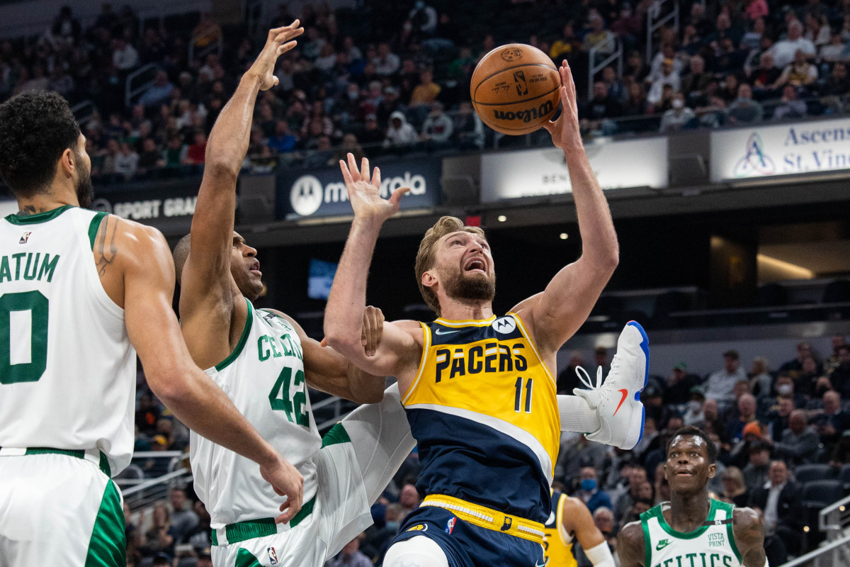 Indiana Pacers forward Domantas Sabonis (11) shoots the ball while Boston Celtics center Al Horford (42) defends in the first half at Gainbridge Fieldhouse.