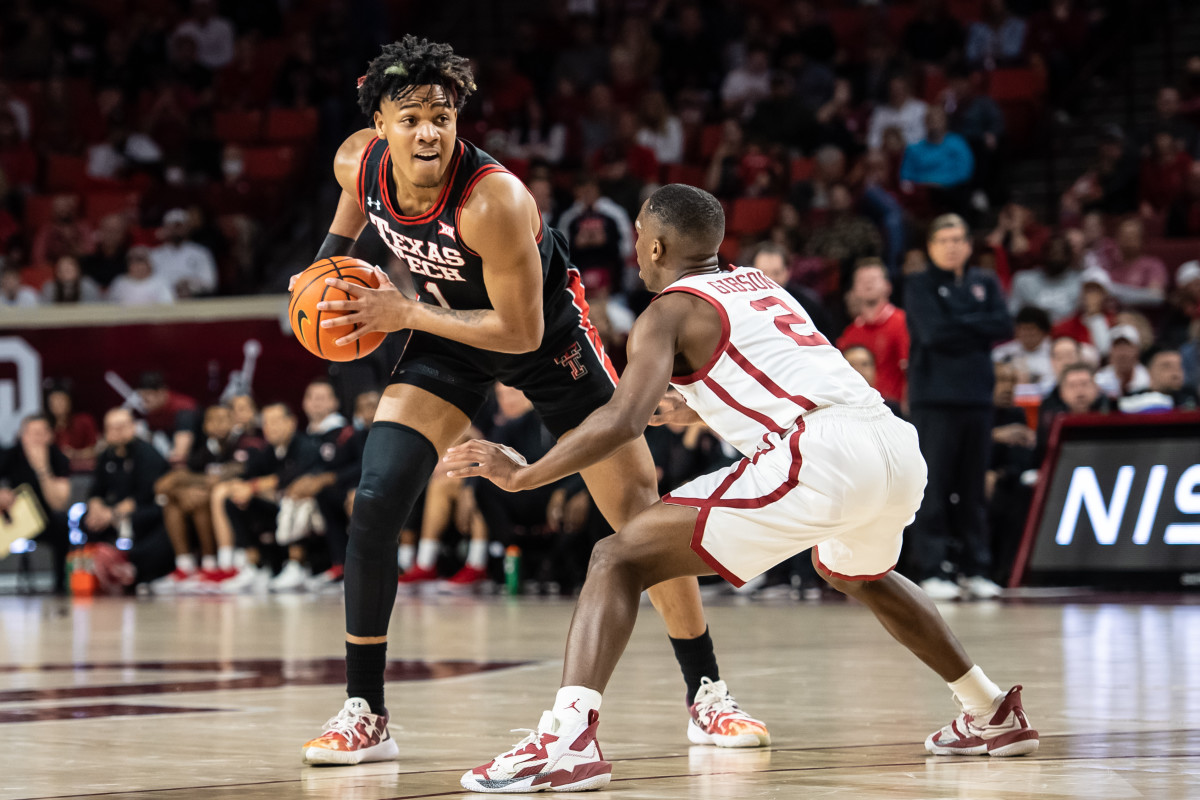 Feb 9, 2022; Norman, Oklahoma, USA; Texas Tech Red Raiders guard Terrence Shannon Jr. (1) with the ball defended by Oklahoma Sooners guard Umoja Gibson (2) during the first half at Lloyd Noble Center