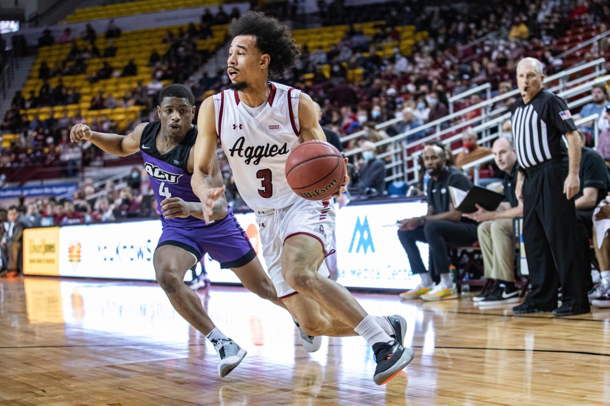 Nate Pryor drives to the basketball for New Mexico State.