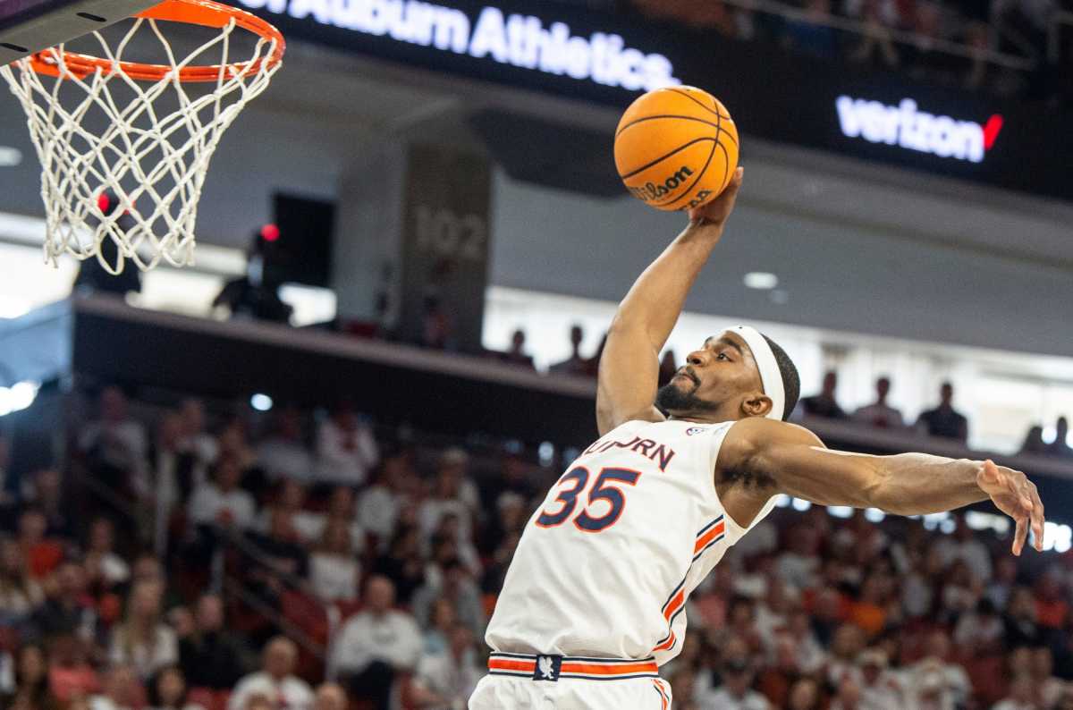 Auburn Tigers guard Devan Cambridge (35) dunks the ball as Auburn Tigers men's basketball takes on Texas A&M Aggies at Auburn Arena in Auburn, Ala., on Saturday, Feb. 12, 2022. Auburn Tigers lead Texas A&M Aggies 33-18 at halftime.