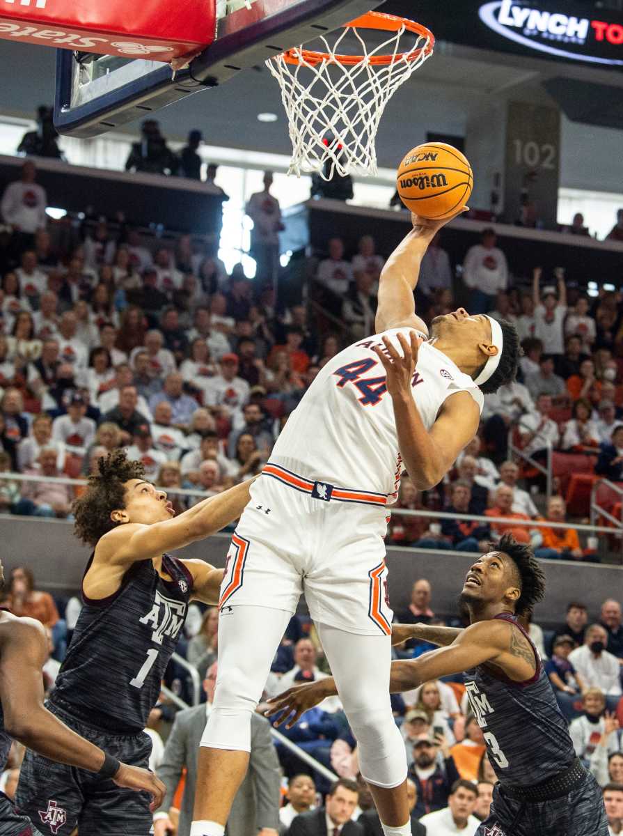 Auburn Tigers center Dylan Cardwell (44) rebounds the ball as Auburn Tigers men's basketball takes on Texas A&M Aggies at Auburn Arena in Auburn, Ala., on Saturday, Feb. 12, 2022. Auburn Tigers lead Texas A&M Aggies 33-18 at halftime.