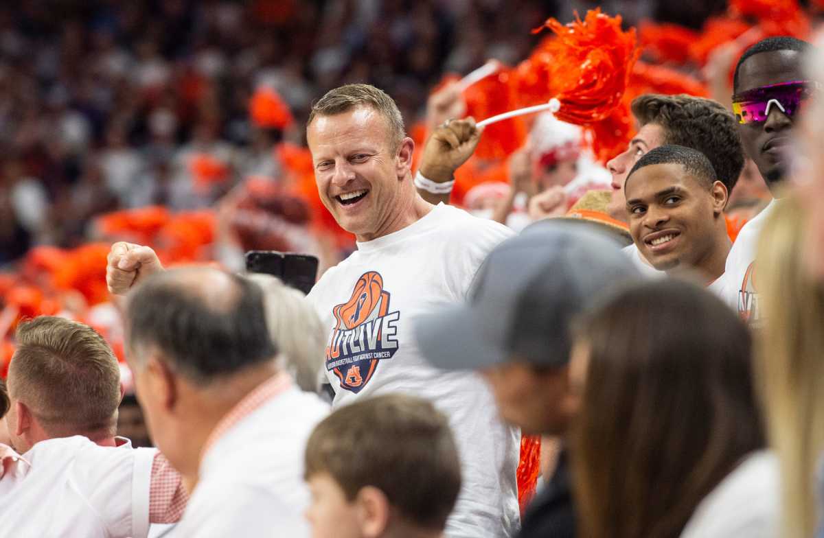 Auburn football head coach Bryan Harsin greets fans as Auburn Tigers men's basketball takes on Texas A&M Aggies at Auburn Arena in Auburn, Ala., on Saturday, Feb. 12, 2022. Auburn Tigers lead Texas A&M Aggies 33-18 at halftime.