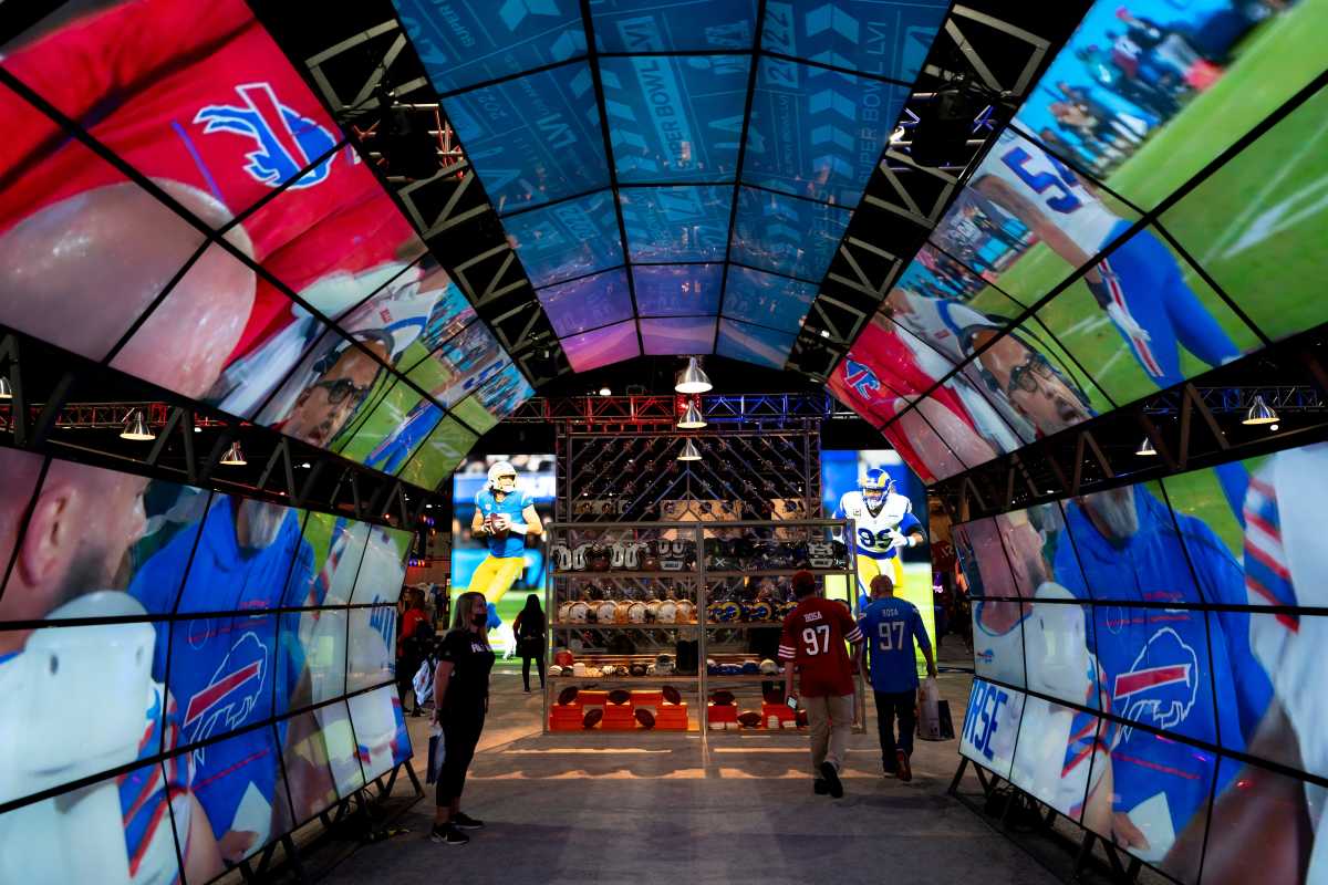 Fans browse the Super Bowl Experience presented by Lowe's Friday, Feb. 11, 2022, at the LA Convention Center in Las Angeles, Calif.