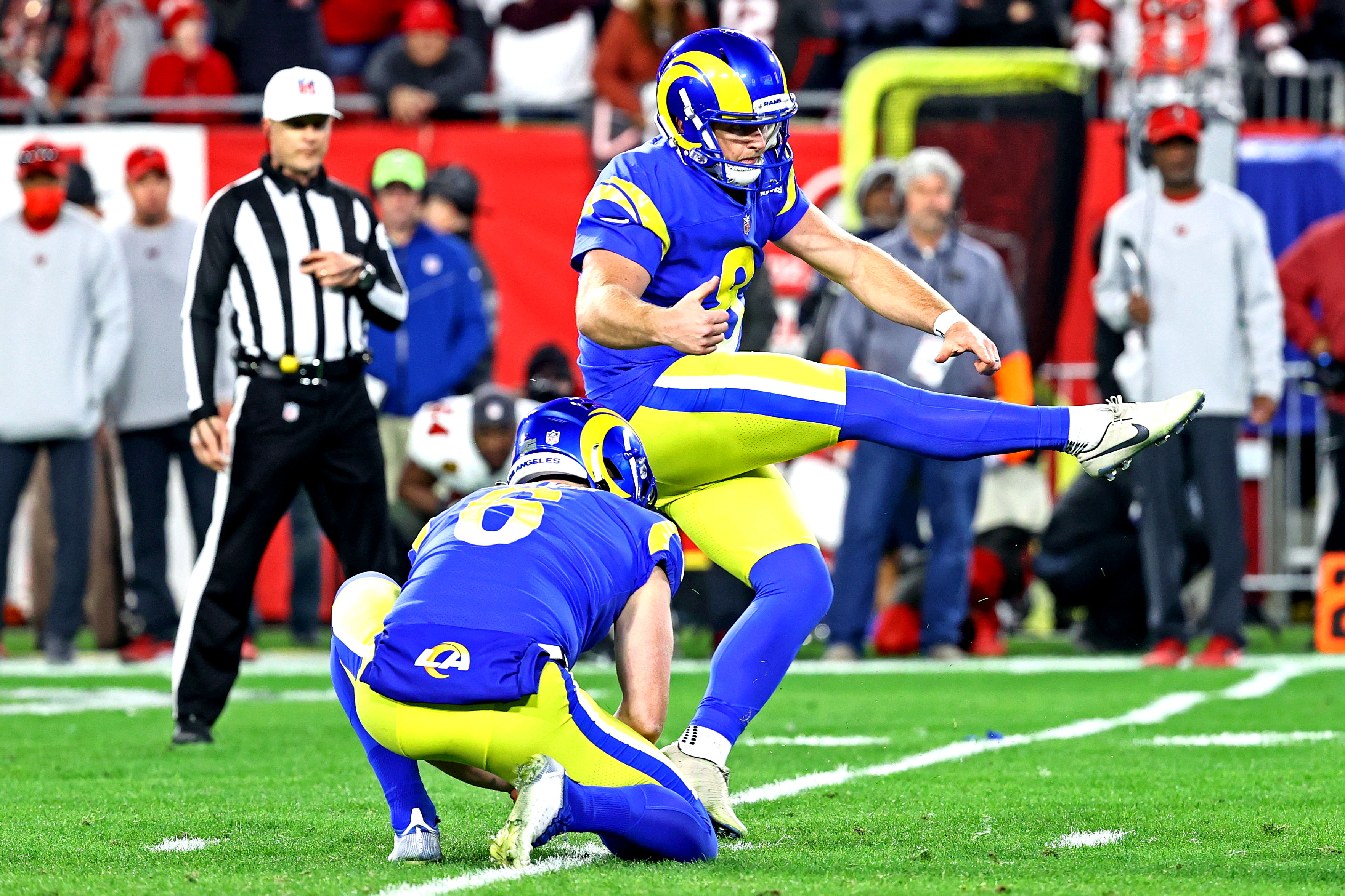 Jan 23, 2022; Tampa, Florida, USA; Los Angeles Rams kicker Matt Gay (8) kicks the game winning field goal during the second half against the Tampa Bay Buccaneers in a NFC Divisional playoff football game at Raymond James Stadium. Mandatory Credit: Kim Klement-USA TODAY Sports