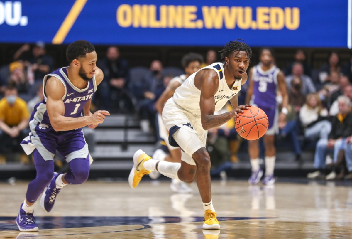 Jan 8, 2022; Morgantown, West Virginia, USA; West Virginia Mountaineers guard Kedrian Johnson (0) steals the ball from Kansas State Wildcats guard Markquis Nowell (1) during the second half at WVU Coliseum.