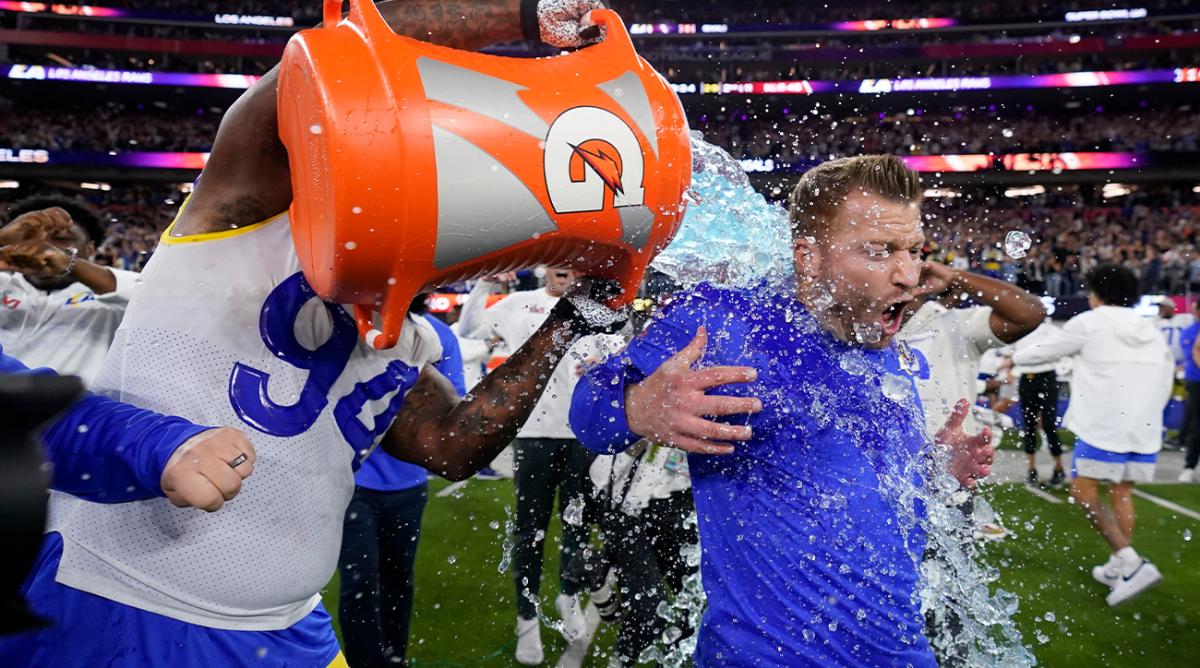 Los Angeles Rams defensive end A'Shawn Robinson, left, pours Gatorade over Los Angeles Rams head coach Sean McVay after the Rams defeated the Cincinnati Bengals NFL Super Bowl 56 football game Sunday, Feb. 13, 2022, in Inglewood, Calif.