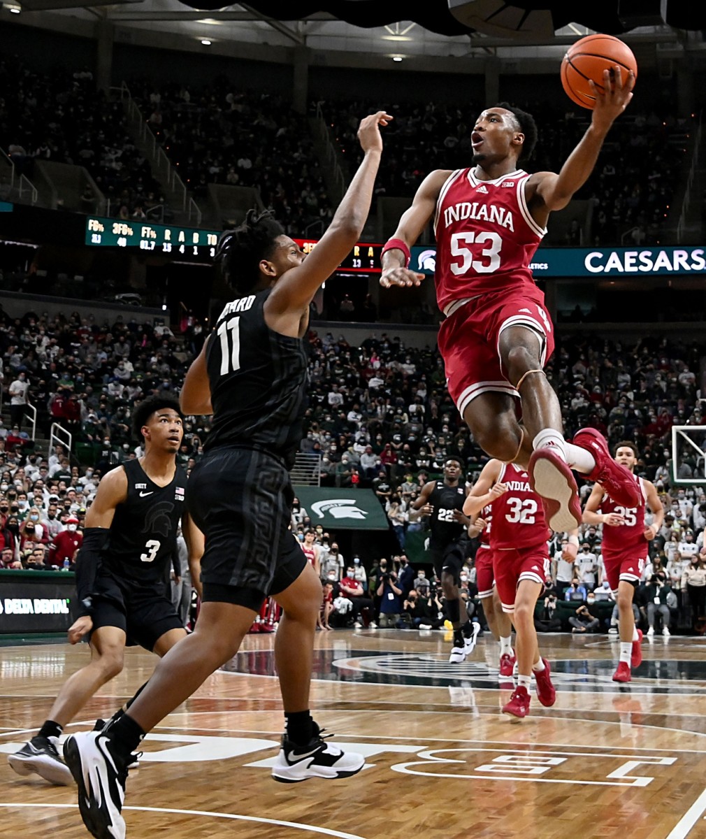 Indiana guard Tamar Bates (53) drives to the basket against Michigan State's A.J. Hoggard (11) ion Saturday at the Breslin Center in East Lansing, Mich,. (Dale Young/USA TODAY Sports)