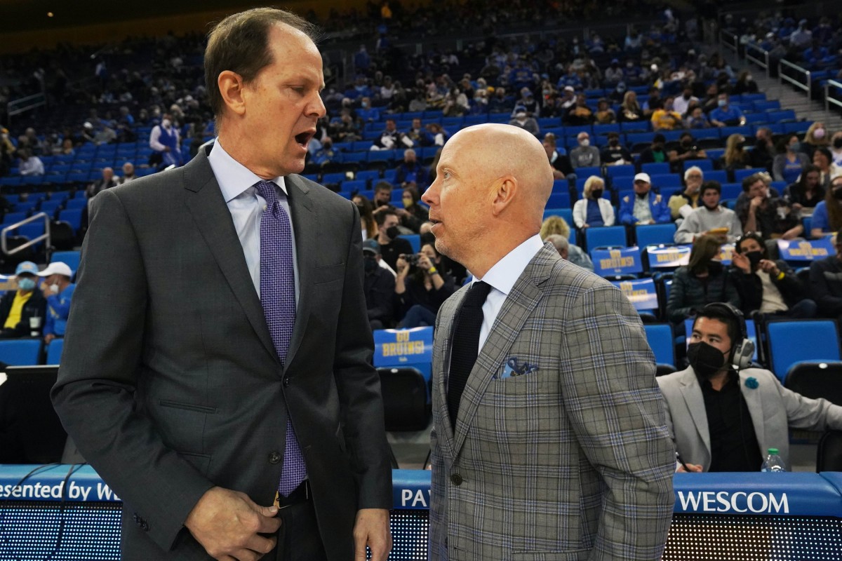 Mike Hopkins makes a point to UCLA's Mick Cronin.