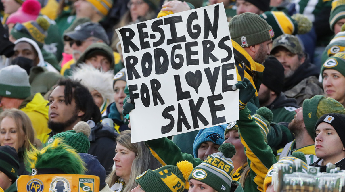 A fan holds a sign about Packers quarterback Aaron Rodgers during the first quarter of their game Sunday, November 14, 2021 at Lambeau Field in Green Bay.