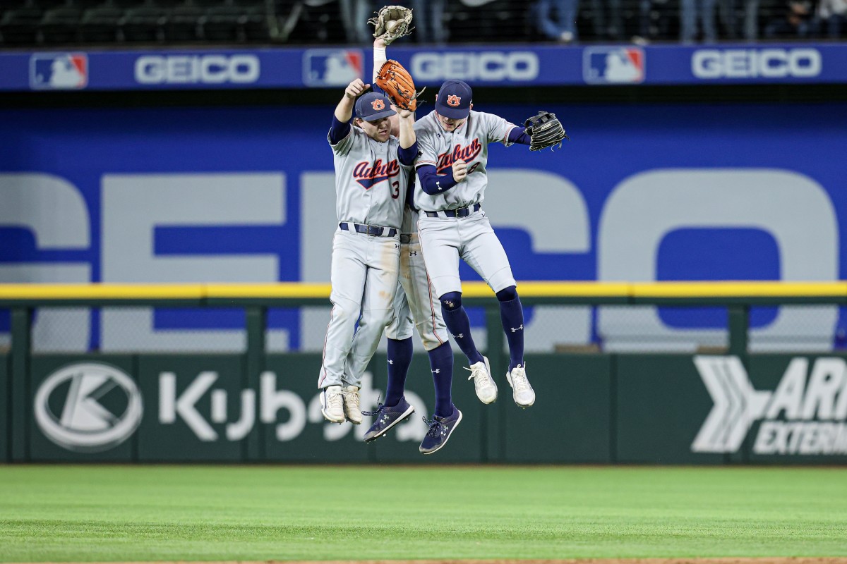 Auburn baseball celebrates after beating Kansas State.