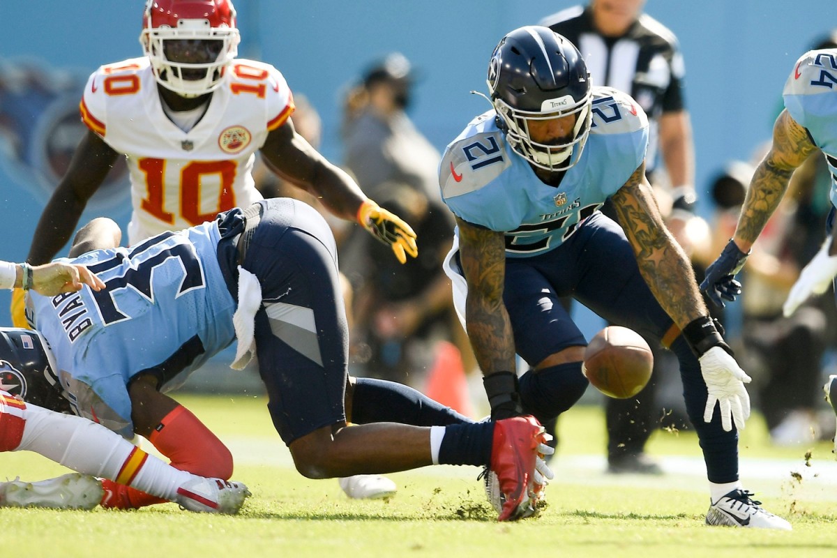 Tennessee Titans defensive back Matthias Farley (21) recovers a fumble from Kansas City Chiefs quarterback Patrick Mahomes (15) at Nissan Stadium Sunday, Oct. 24, 2021 in Nashville, Tenn.