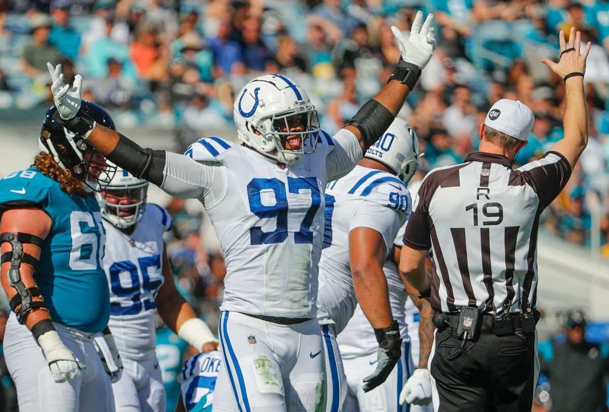 Indianapolis Colts defensive end Al-Quadin Muhammad (97) celebrates after sacking Jacksonville Jaguars quarterback Trevor Lawrence (16) during the first quarter of the game Sunday, Jan. 9, 2022, at TIAA Bank Field in Jacksonville, Fla. The Indianapolis Colts Versus Jacksonville Jaguars On Sunday Jan 9 2022 Tiaa Bank Field In Jacksonville Fla