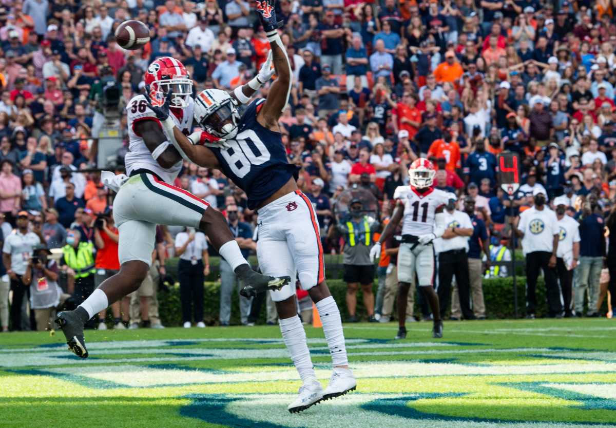 Georgia Bulldogs defensive back Latavious Brini (36) breaks up a pass intended for Auburn Tigers wide receiver Ze'Vian Capers (80) in the end zone on fourth down at Jordan-Hare Stadium in Auburn, Ala., on Saturday, Oct. 9, 2021. Georgia Bulldogs lead the Auburn Tigers 17-3 at halftime.