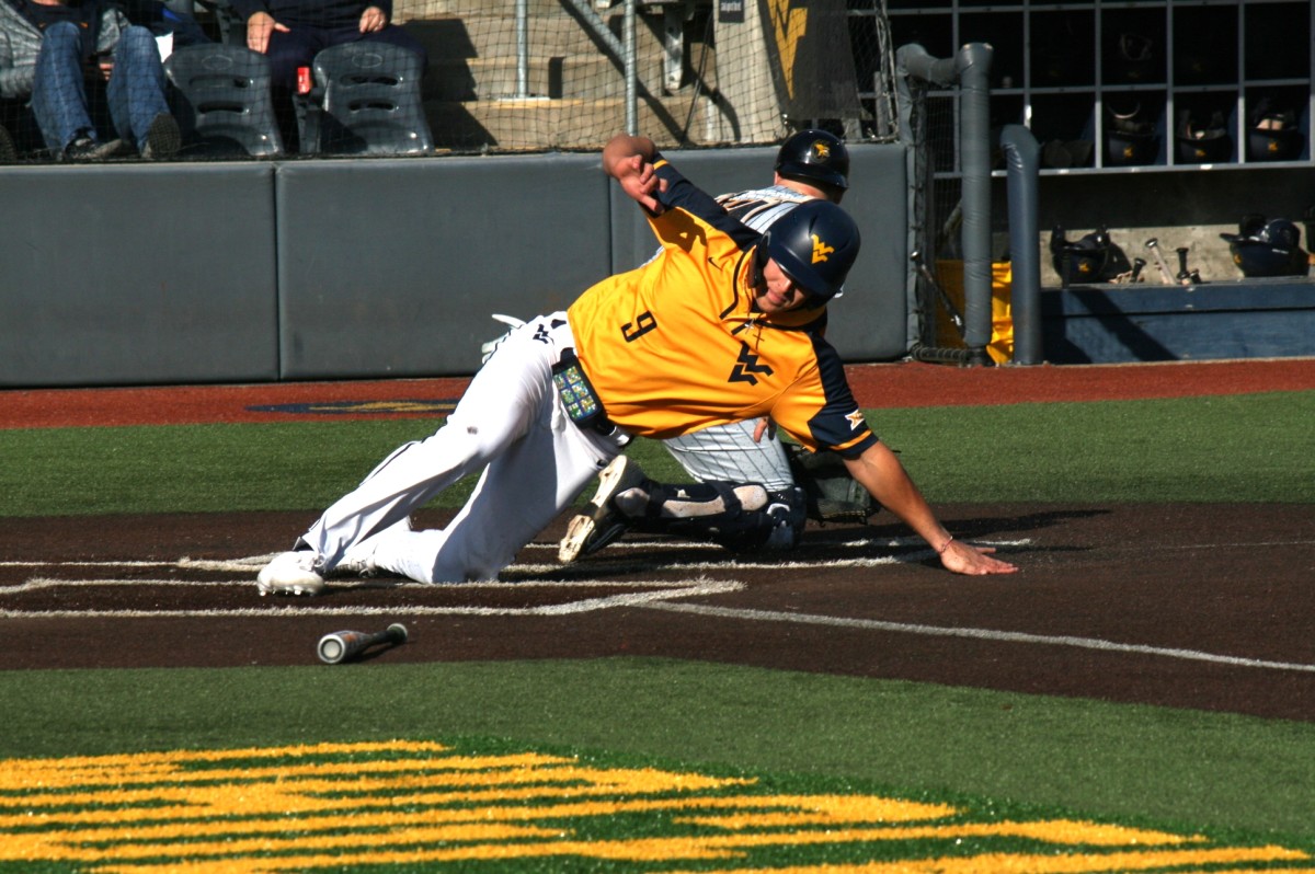 Grant Hussey slides home in the second inning.