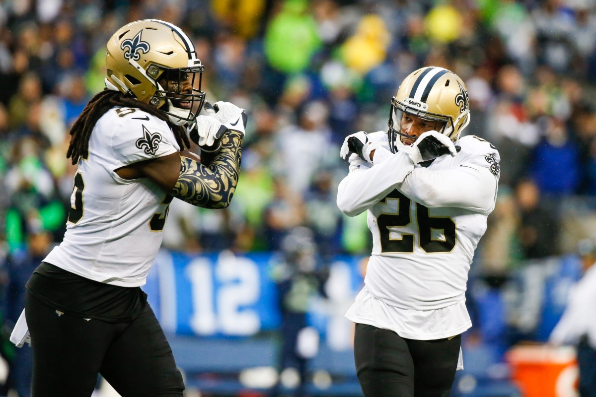 The New Orleans Saints defense celebrates a P.J. Williams (26