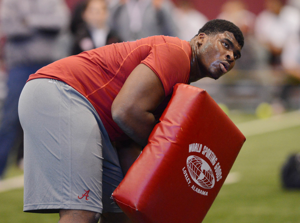 Alabama Crimson Tide offensive lineman D.J. Fluker does bag drills during Alabama pro day at the Mal M. Moore Athletic Facility.