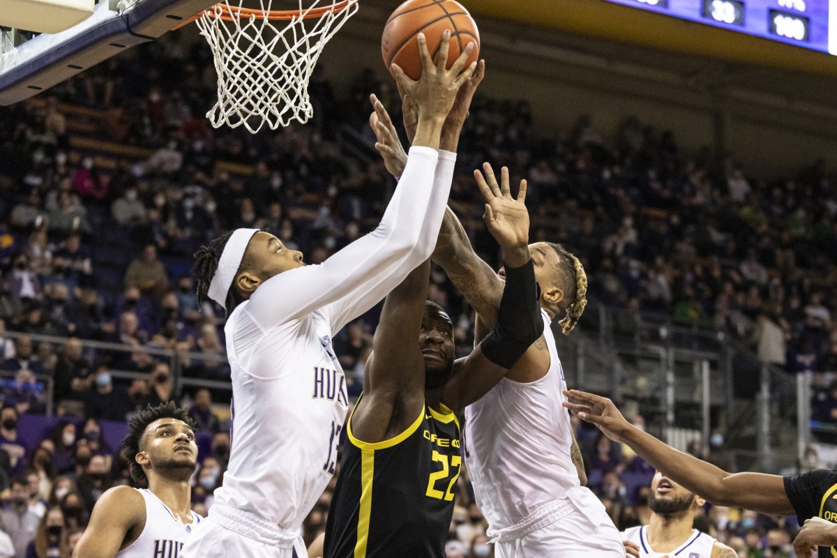 Langston Wilson grabs a rebound in a crowd.