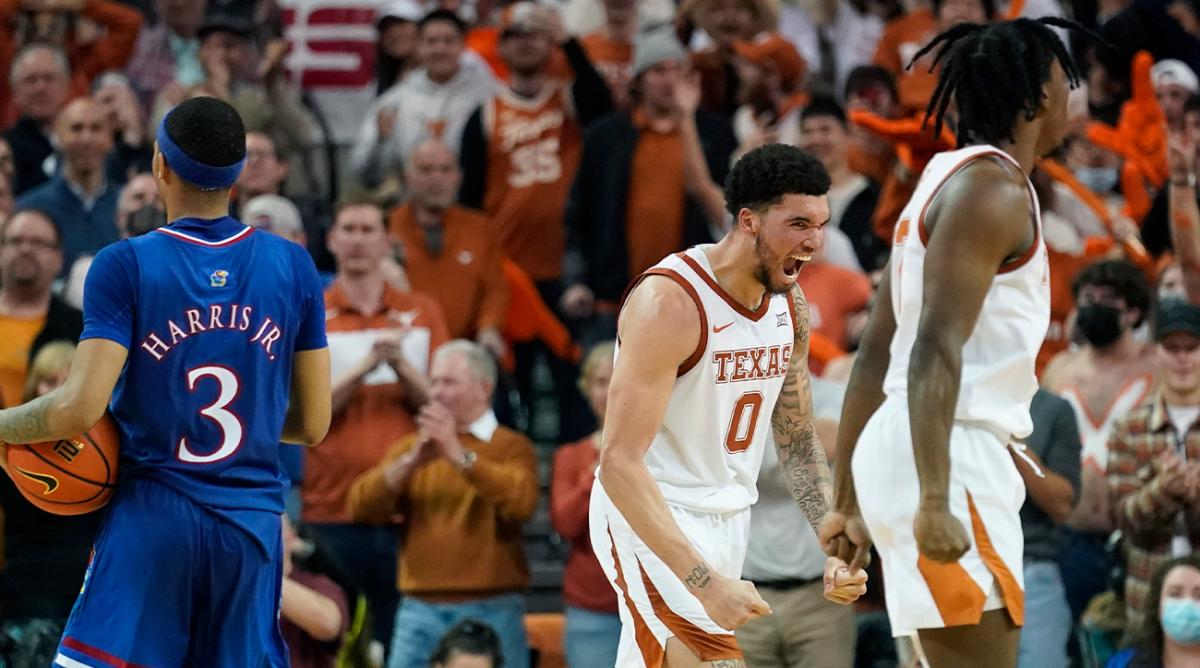 Texas forward Timmy Allen (0) celebrates a score against Kansas during the second half of an NCAA college basketball game, Monday, Feb. 7, 2022, in Austin, Texas.