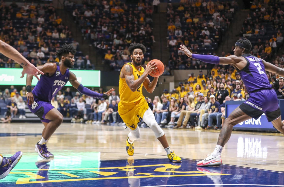 Mar 5, 2022; Morgantown, West Virginia, USA; West Virginia Mountaineers guard Taz Sherman (12) drives down the lane during the second half against the TCU Horned Frogs at WVU Coliseum.