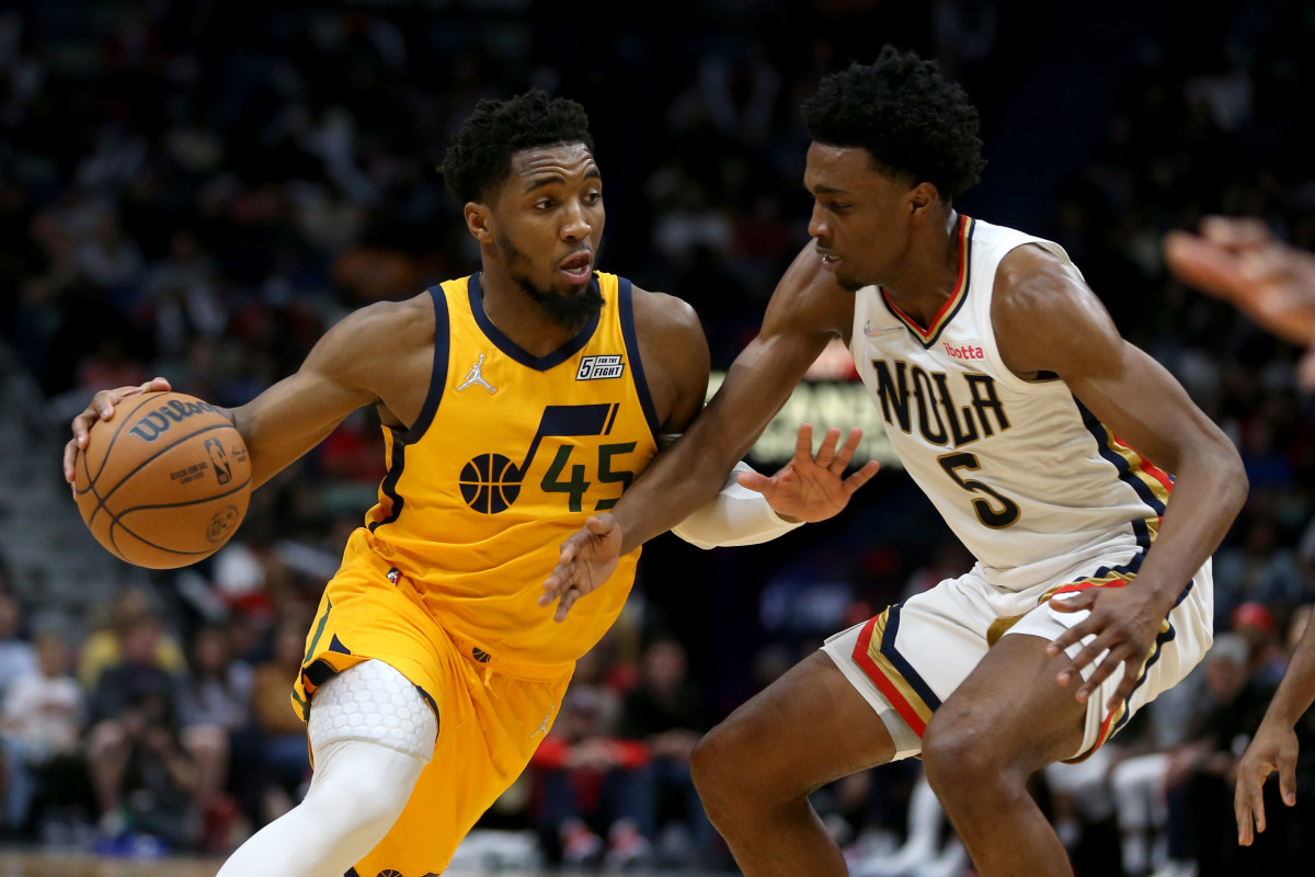 Utah Jazz guard Donovan Mitchell (45) is defended by New Orleans Pelicans forward Herbert Jones (5) in the second half at the Smoothie King Center.