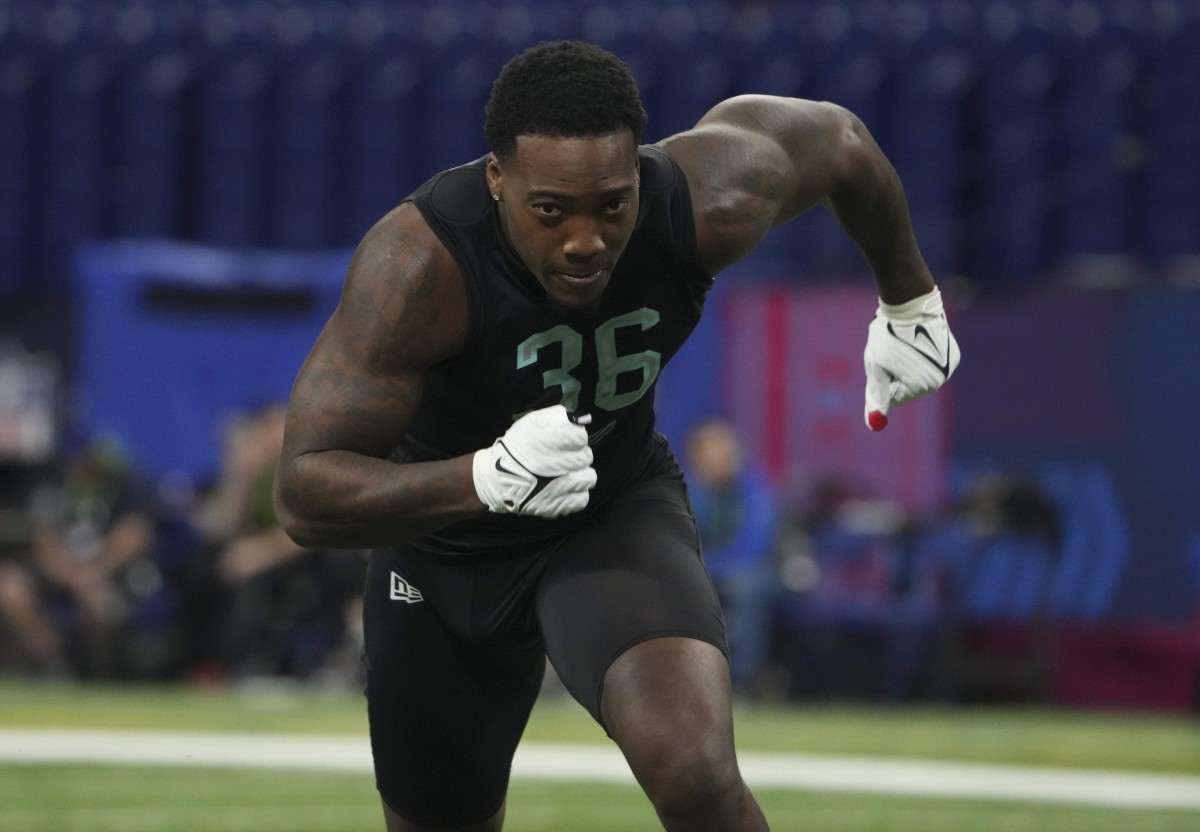 Georgia linebacker Quay Walker (36) participates in the broad jump