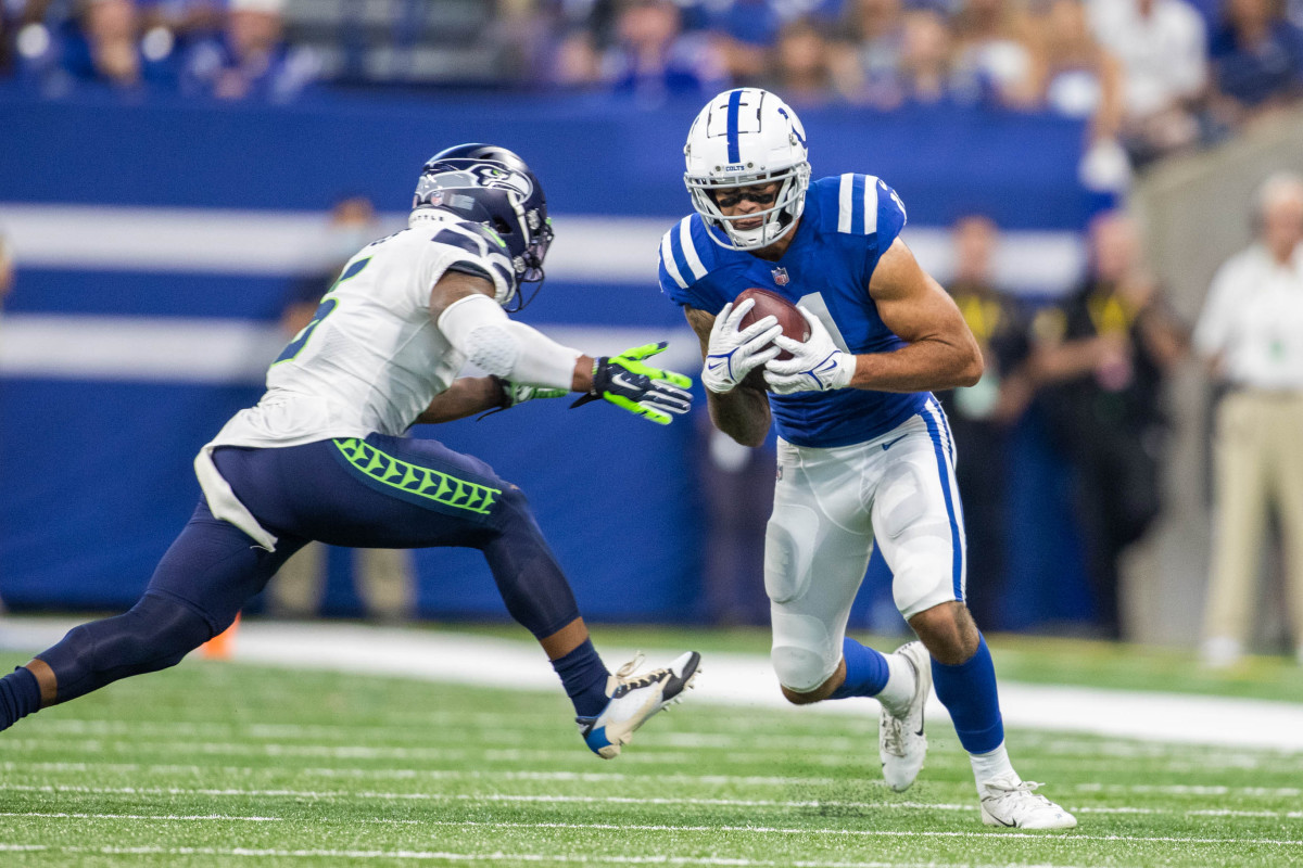 Sep 12, 2021; Indianapolis, Indiana, USA; Indianapolis Colts wide receiver Michael Pittman (11) catches the ball while Seattle Seahawks strong safety Quandre Diggs (6) defends in the second quarter at Lucas Oil Stadium. Mandatory Credit: Trevor Ruszkowski-USA TODAY Sports