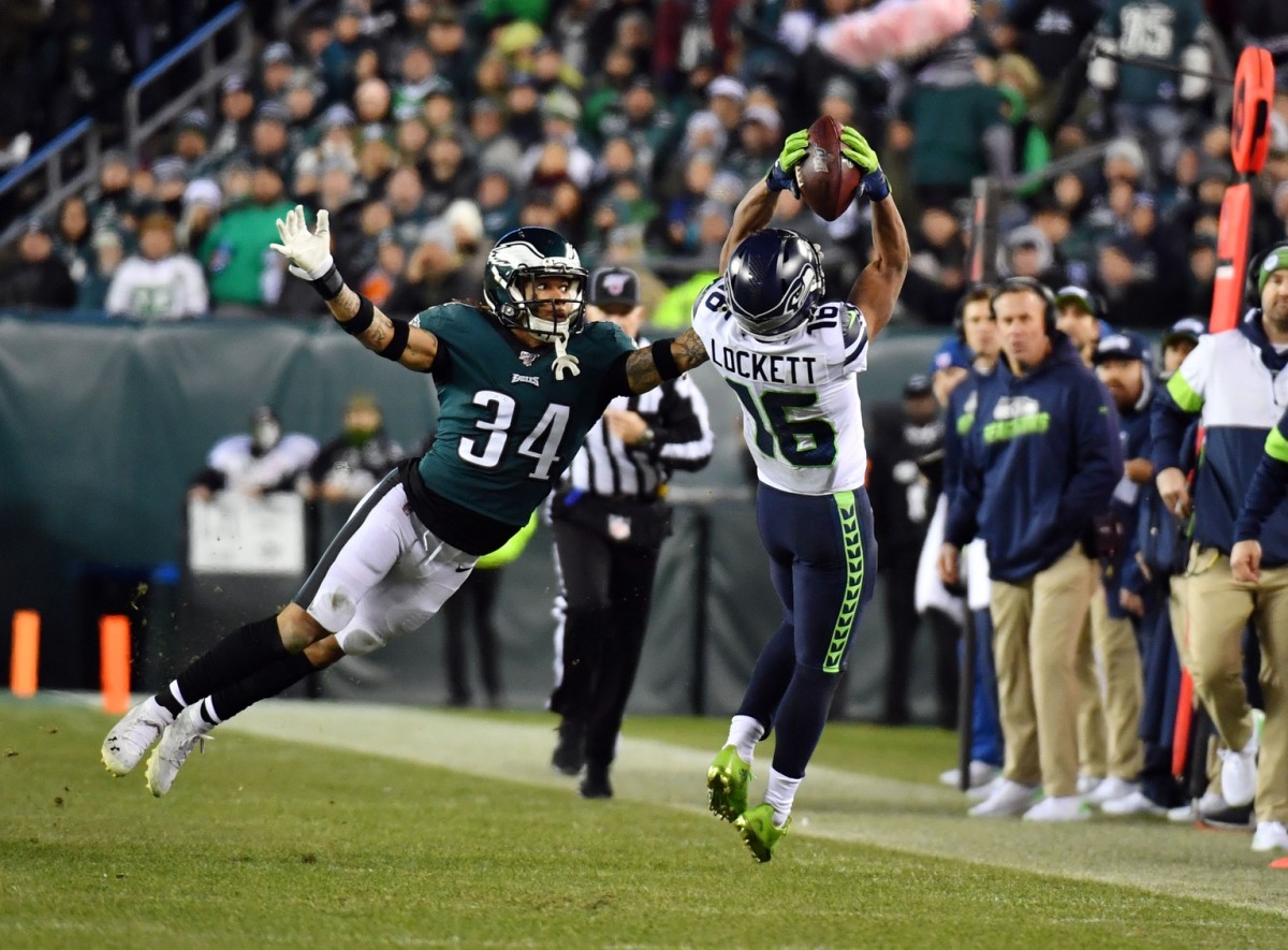 Seattle Seahawks kickoff return team surround Seattle Seahawks wide  receiver Tyler Lockett (16) after he returned a 99-yard kickoff or a  touchdown against the Arizona Cardinals during the first quarter at  CenturyLink