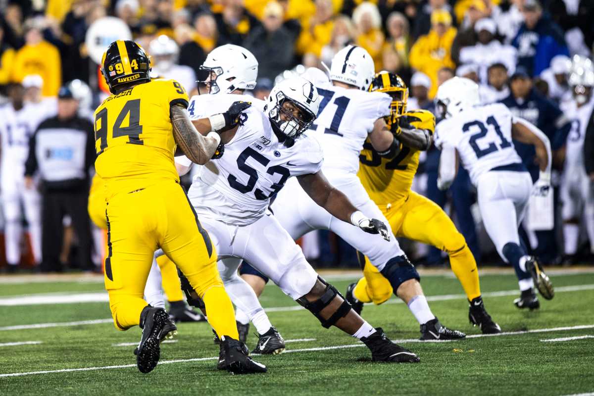 Iowa defensive end A.J. Epenesa (94) gets blocked by Penn State offensive lineman Rasheed Walker (53) during a NCAA Big Ten Conference football game between the Iowa Hawkeyes and Penn State, Saturday, Oct., 12, 2019, at Kinnick Stadium in Iowa City, Iowa. 191012 Penn St Iowa Fb 052 Jpg