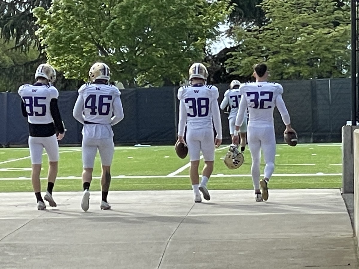 Triston Brown (32) and his fellow kickers Addison Schrock (85), Race Porter (46) and Jarrett North (38) head for some practice privacy in 2021.