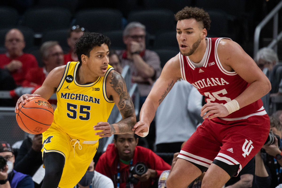 Indiana's Race Thompson guards Michigan's Eli Brooks.