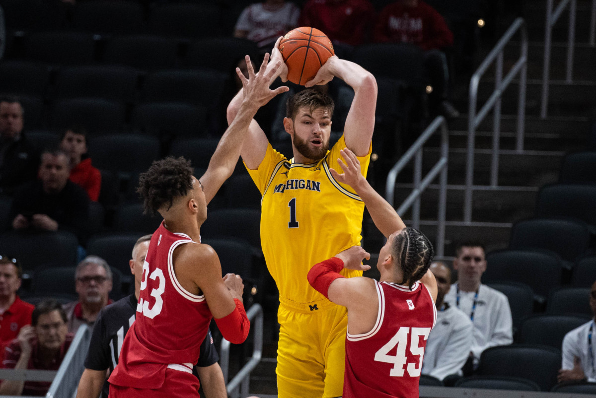 Indiana's Trayce Jackson-Davis and Parker Stewart double team Michigan's Hunter Dickinson.