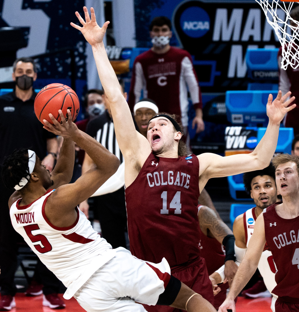 Colgate Raiders forward Keegan Records (14) attempts to block the ball as Arkansas Razorbacks guard Moses Moody (5) attempts to shoot the ball during the first round of the 2021 NCAA Tournament.