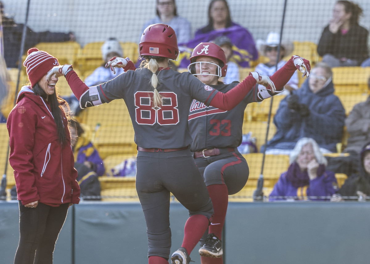 Jenna Johnson and Megan Bloodworth celebrate home run