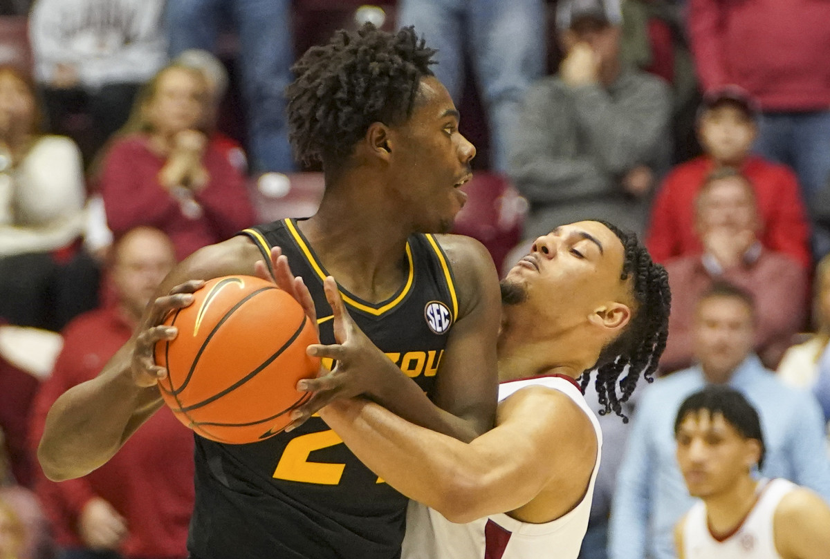 Alabama Crimson Tide guard Jahvon Quinerly (13) reaches in against Missouri Tigers forward Kobe Brown (24) during the second half at Coleman Coliseum.