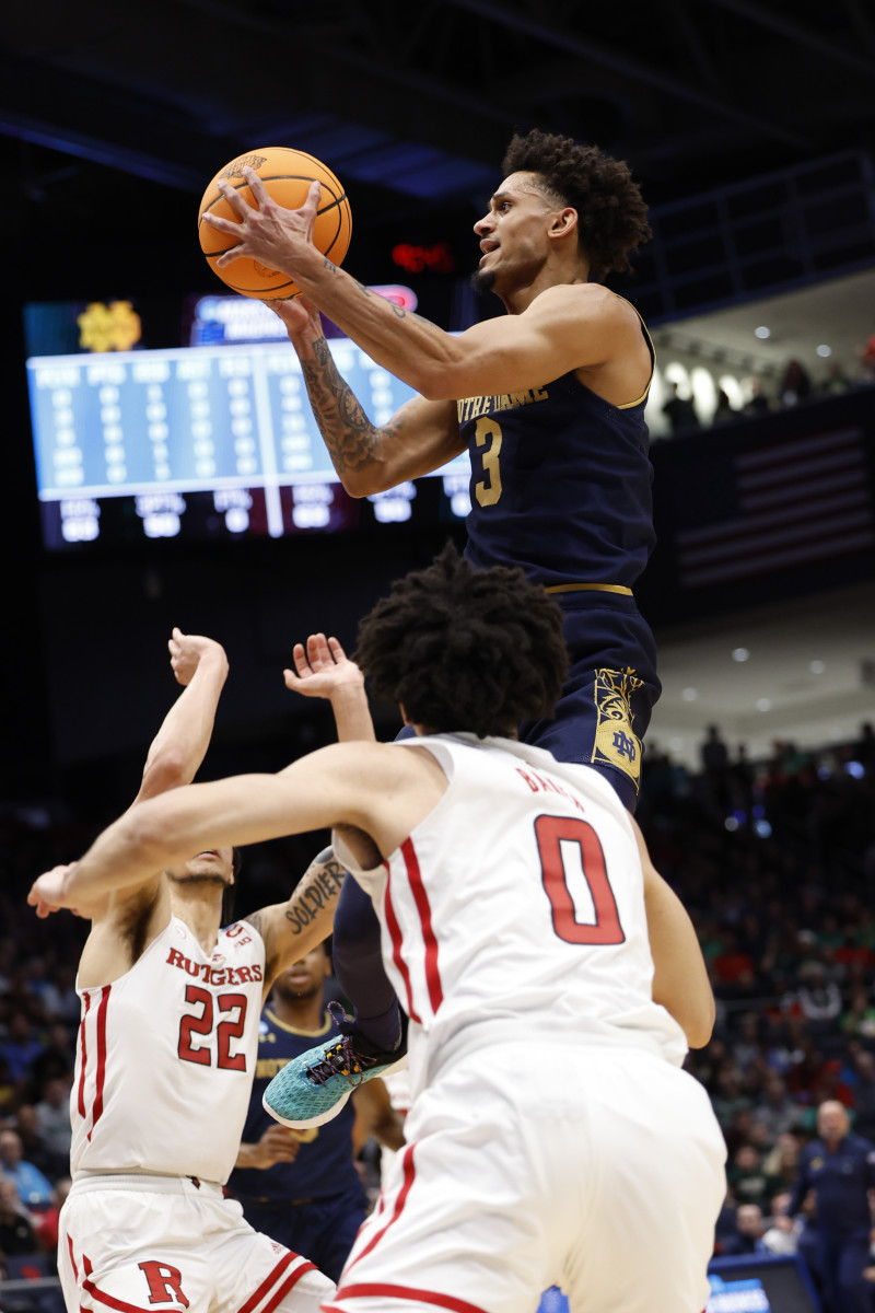 Notre Dame Fighting Irish guard Prentiss Hubb (3) shoots the ball defended by Rutgers Scarlet Knights guard Caleb McConnell (22) and guard Geo Baker (0) in the first half at University of Dayton Arena.