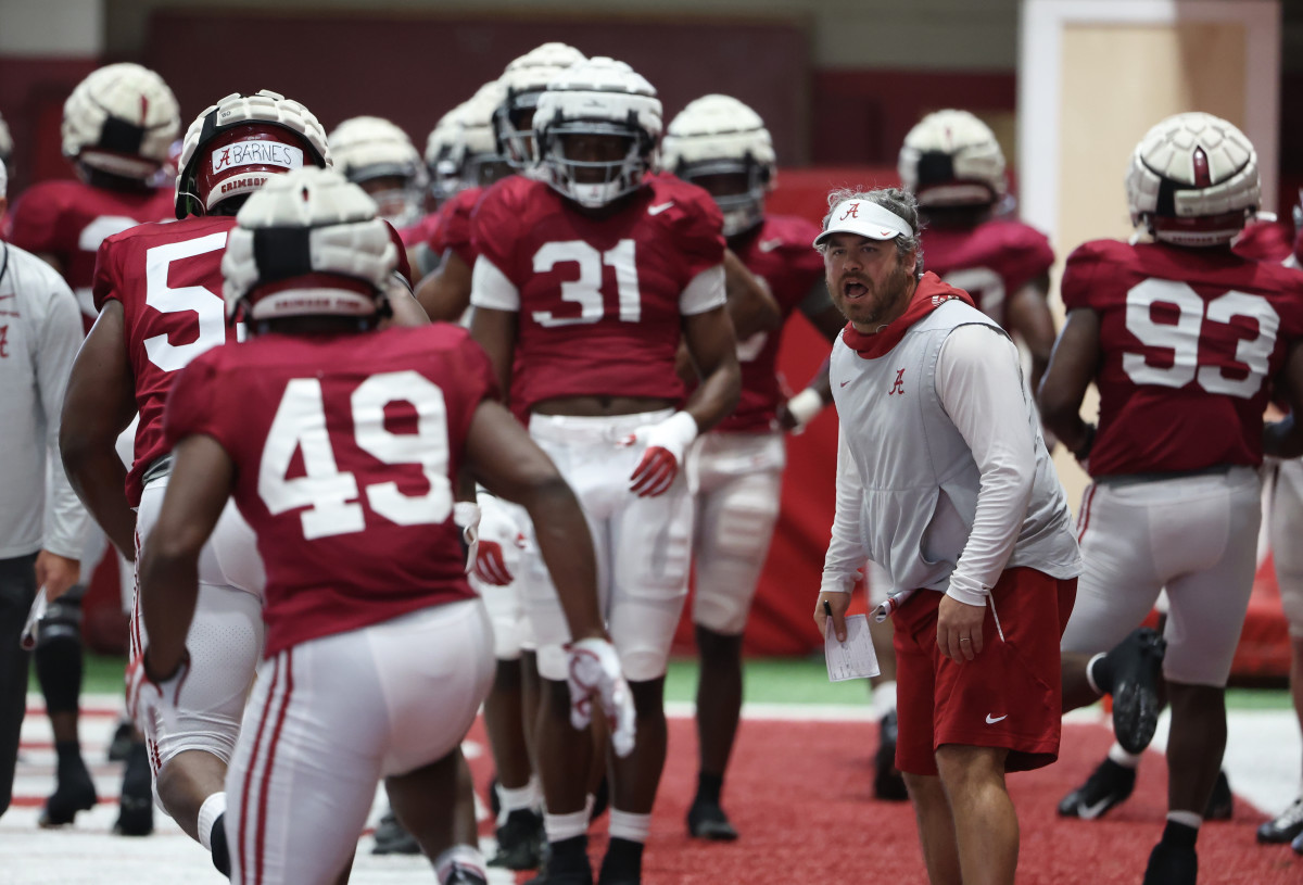 Pete Golding works with defense at practice, March 23, 2022