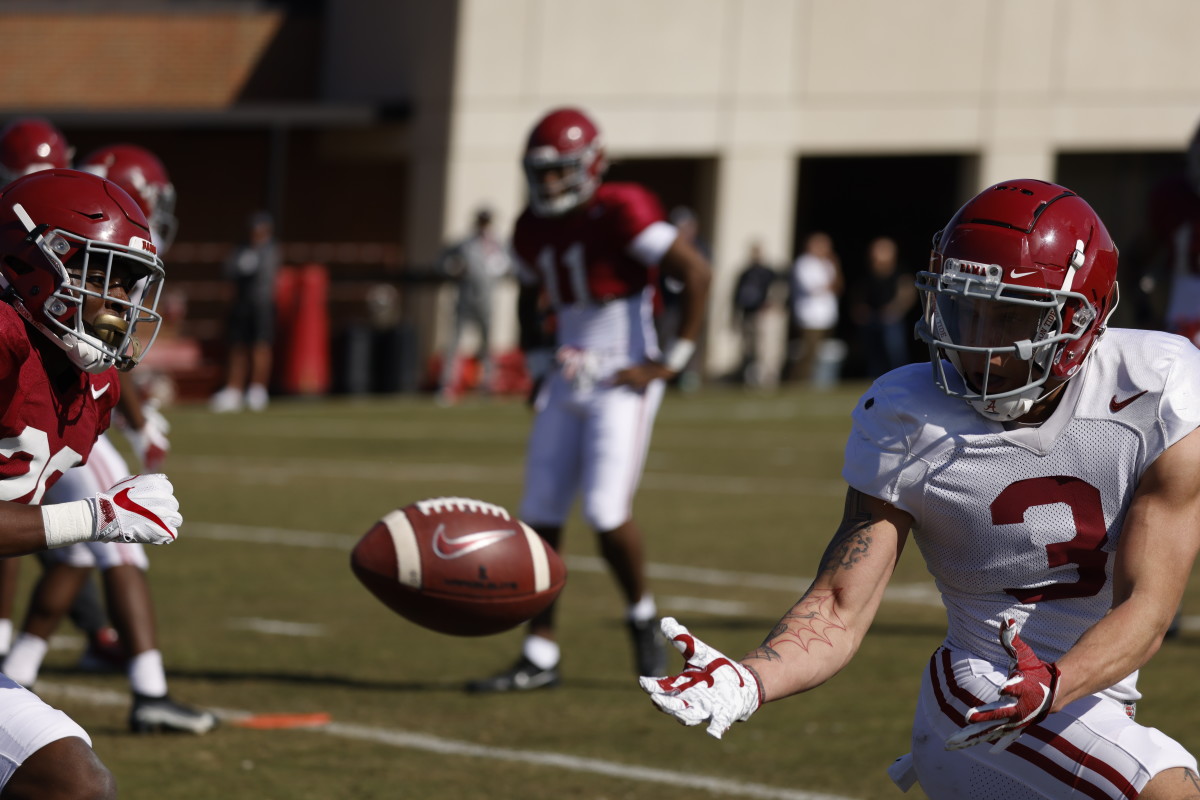 Alabama receiver Jermaine Burton makes a catch during practice