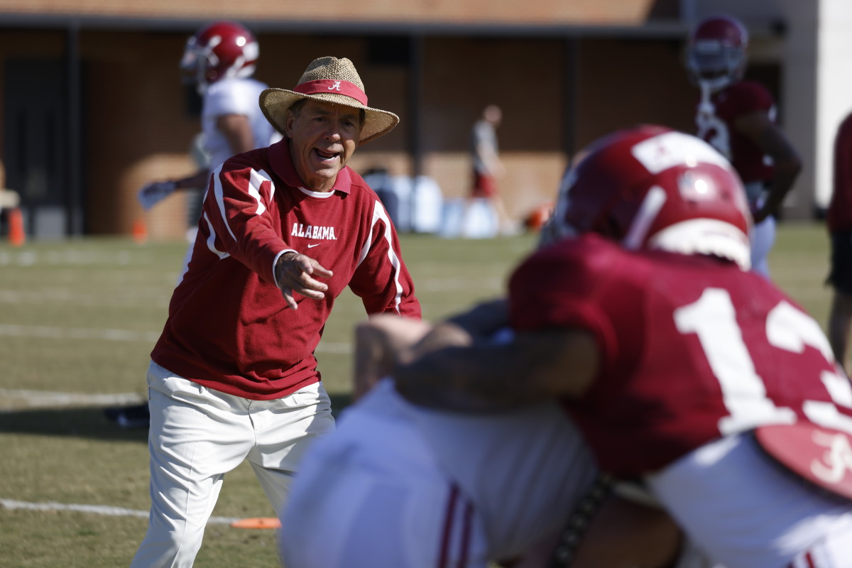 Nick Saban instructs Alabama defensive backs during practice