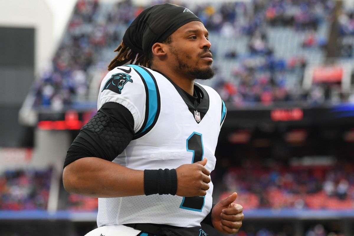 NO FILM, NO VIDEO, NO TV, NO DOCUMENTARY - Carolina Panthers quarterback Cam  Newton (1) walks off the field, as a fan takes a smiling selfie, following  a 24-10 loss to the