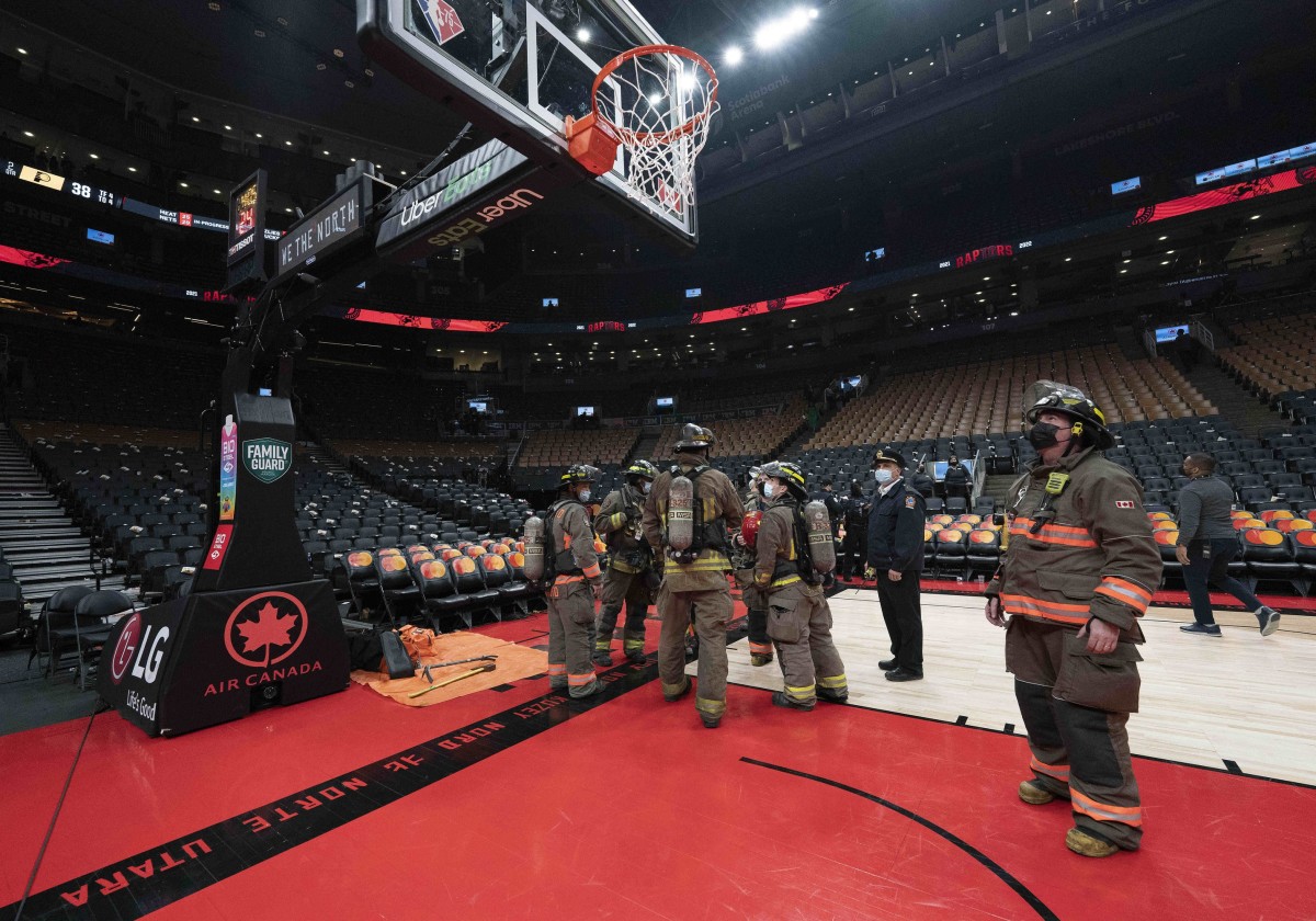 Members of the Toronto Fire Department waits after fans exited Scotiabank Arena due to a fire emergency during the second quarter between the Indiana Pacers and Toronto Raptors