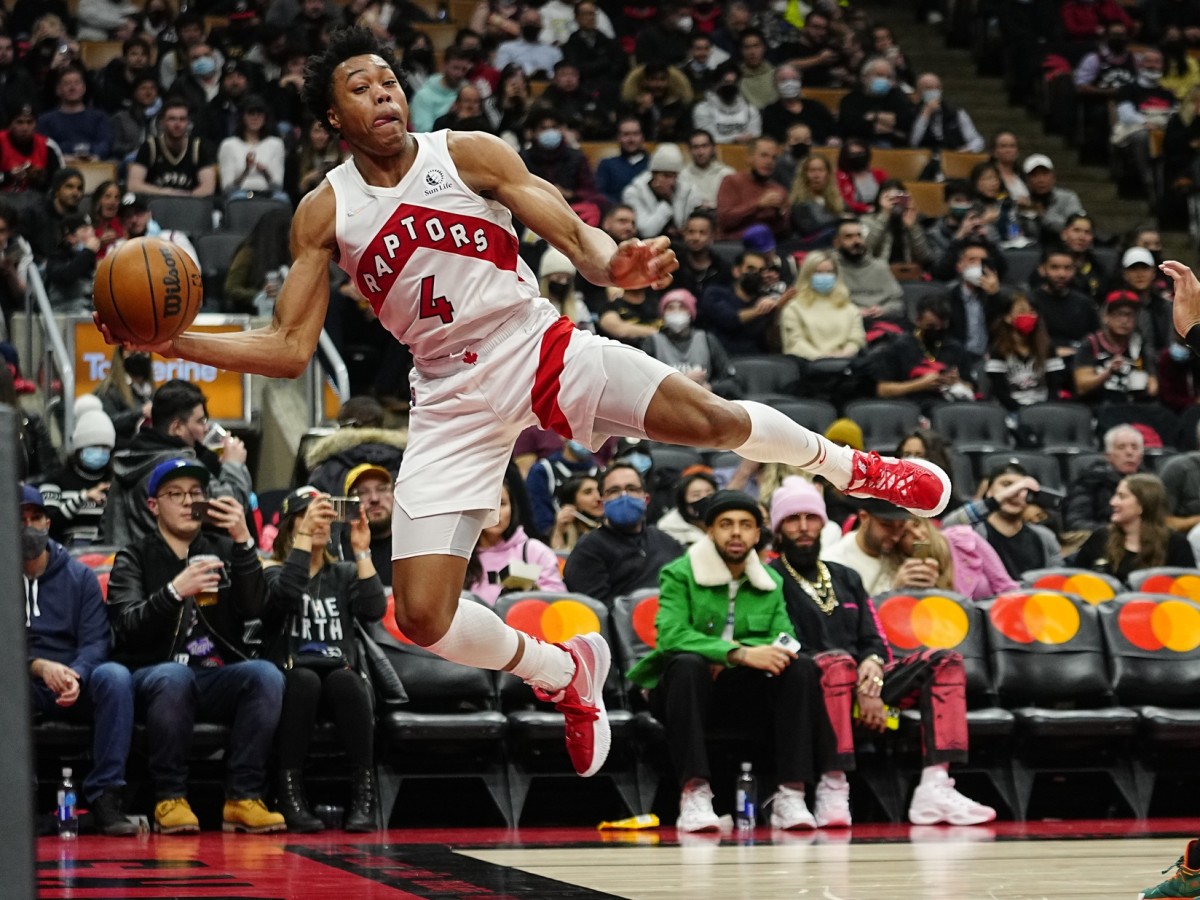 Toronto Raptors forward Scottie Barnes (4) keeps a ball in play against the Brooklyn Nets during the second half at Scotiabank Arena