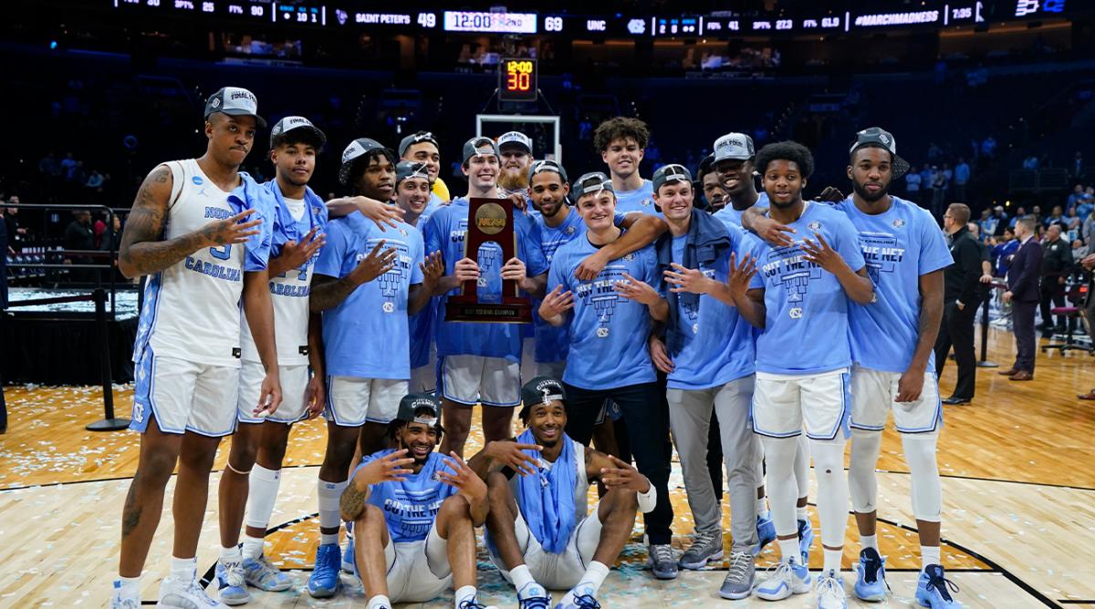 North Carolina players pose for a photo after North Carolina won a college basketball game against St. Peter’s in the Elite 8 round of the NCAA tournament, Sunday, March 27, 2022, in Philadelphia.